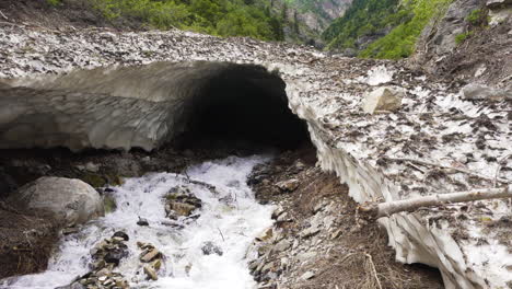 view of an avalanche covered canyon during the spring thaw