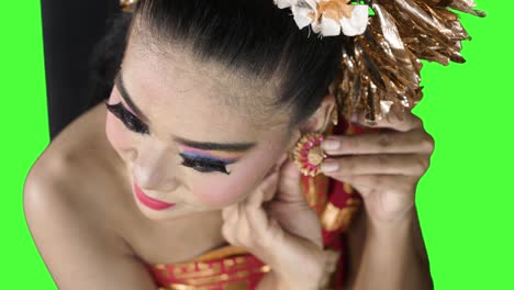 balinese dancer wearing earrings accessories