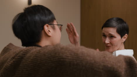 image of people interacting indoors