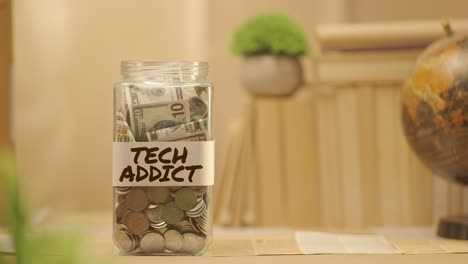 person saving money for tech addict