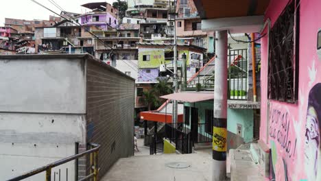 establishing shot of electric escalator in comuna 13 shanty town