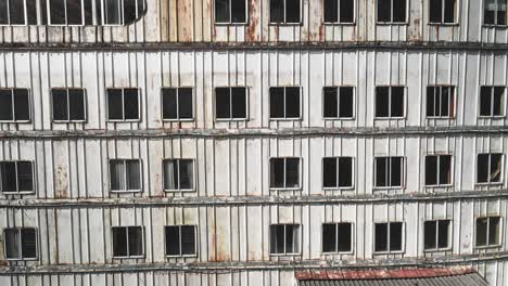 old design of the windows of an old cruise ship, drone view of an old hotel-resort, panoramic view of the drone flying over the old hotel windows