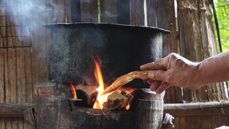 A-shot-of-an-old-school-pot,-which-is-placed-on-top-of-a-fire-in-Thailand-in-Asia