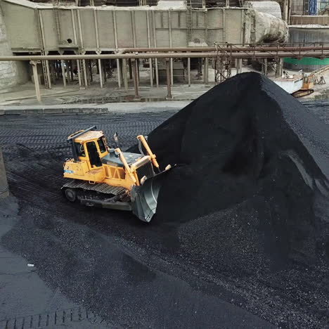 crawler bulldozer loading coal. coal industry. black gold