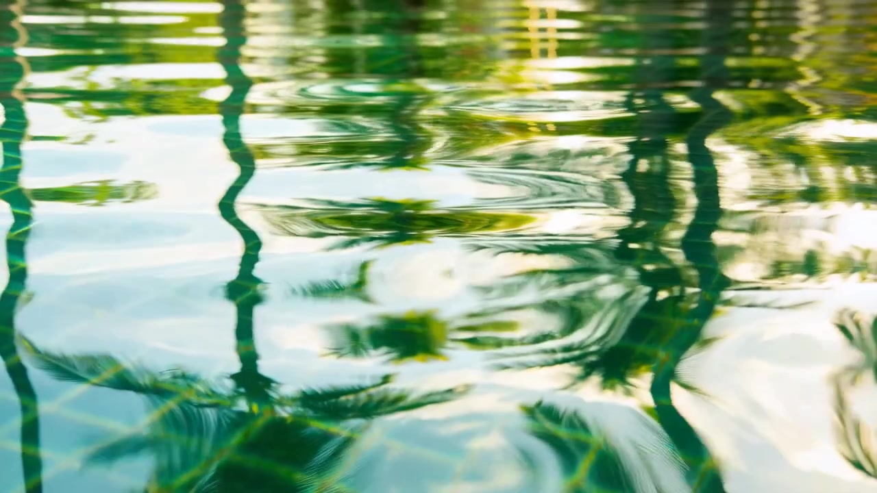 Rippling pool water reacting to center-right motion, bending palm reflections, tiled floor showing