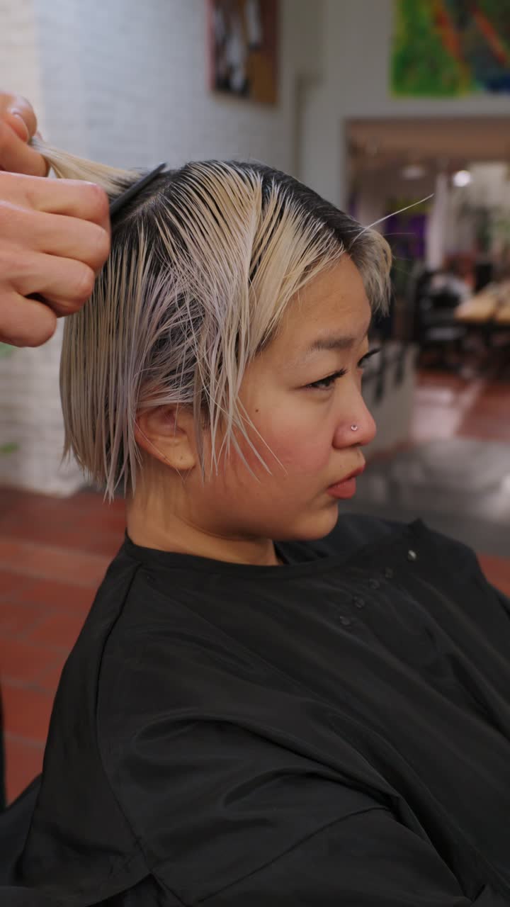 Woman getting her hair dyed