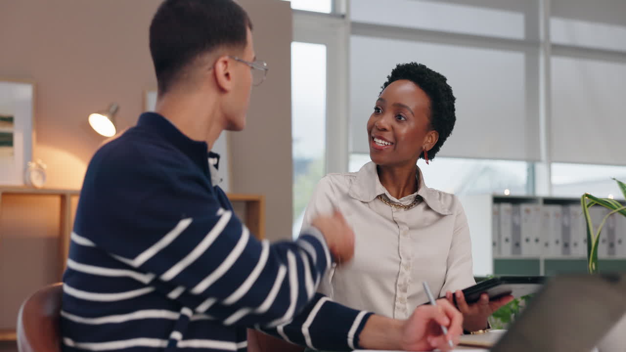 Two business people shaking hands