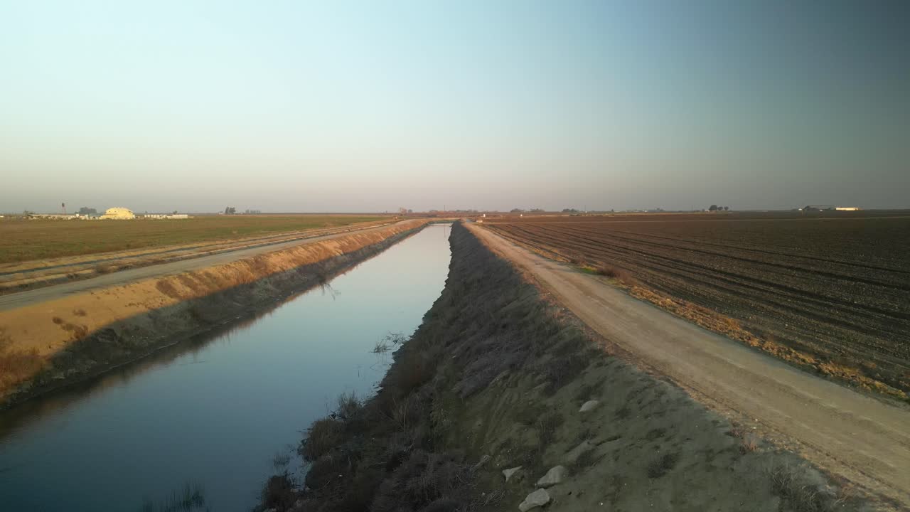 The drone ascends over Lake Tulare, offering a view of fertile farmlands, earthy textures, and the region’s rural beauty in vivid detail.