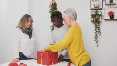 people wrapping a gift