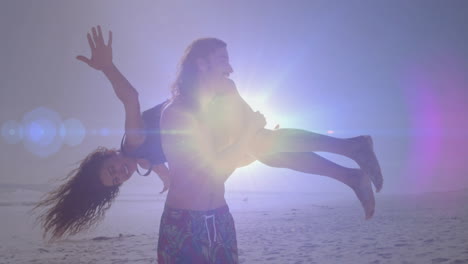 carrying woman playfully, man enjoying beach with bright sunlight in background