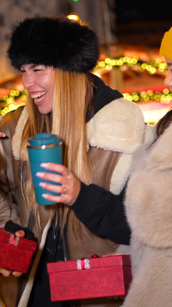 Friends enjoying Christmas market with gifts