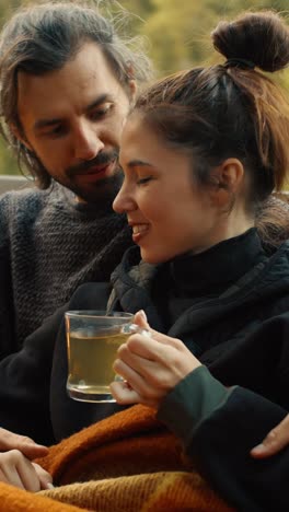couple enjoying tea outdoors