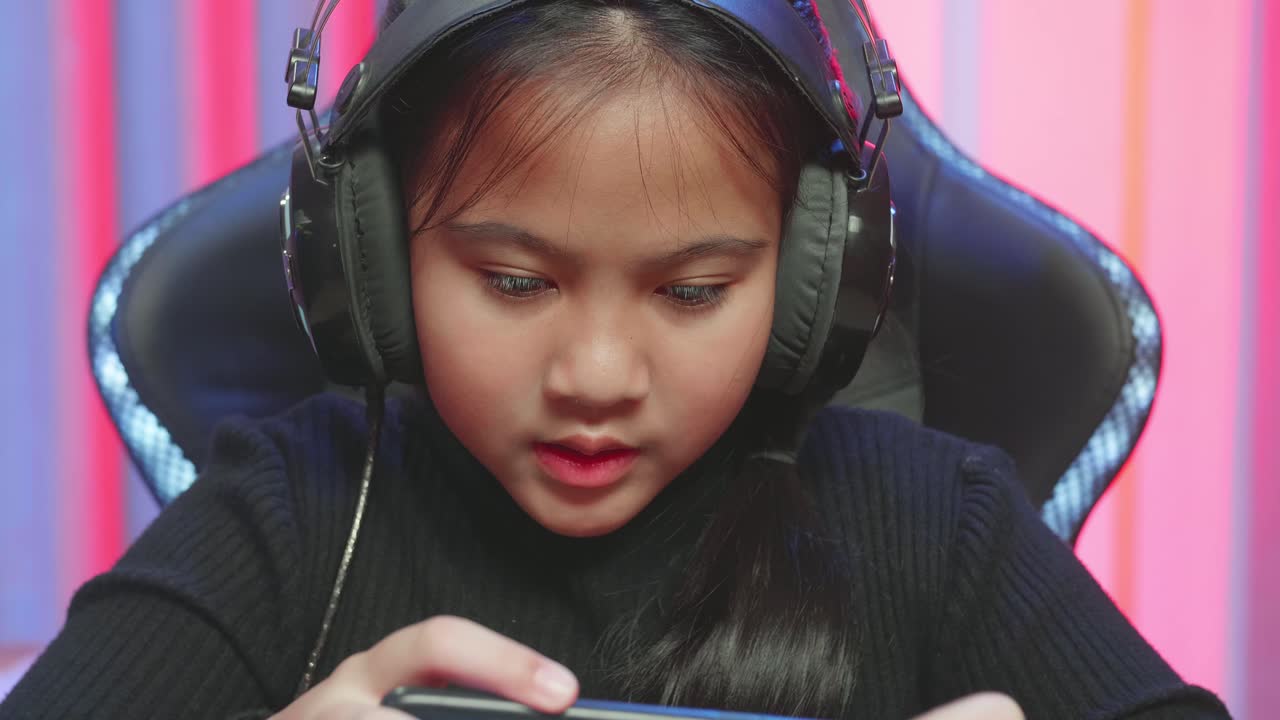 Young Girl Playing Mobile Game