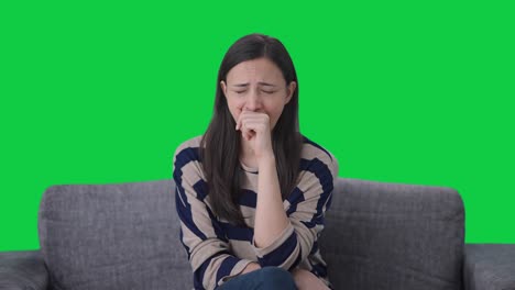 Tired-Indian-girl-watching-TV-Green-screen