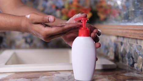 person washing hands with soap