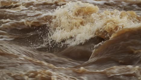 Slow-Motion-Shot-of-Powerful-crashing-water-in-Mara-river,-waves-and-turbulent-stream,-African-nature-in-Maasai-Mara-National-Reserve,-Kenya,-Africa-Safari-trips-in-Masai-Mara-North-Conservancy