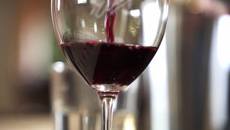 pouring red wine into the wine glass in barossa valley, adelaide, south australia