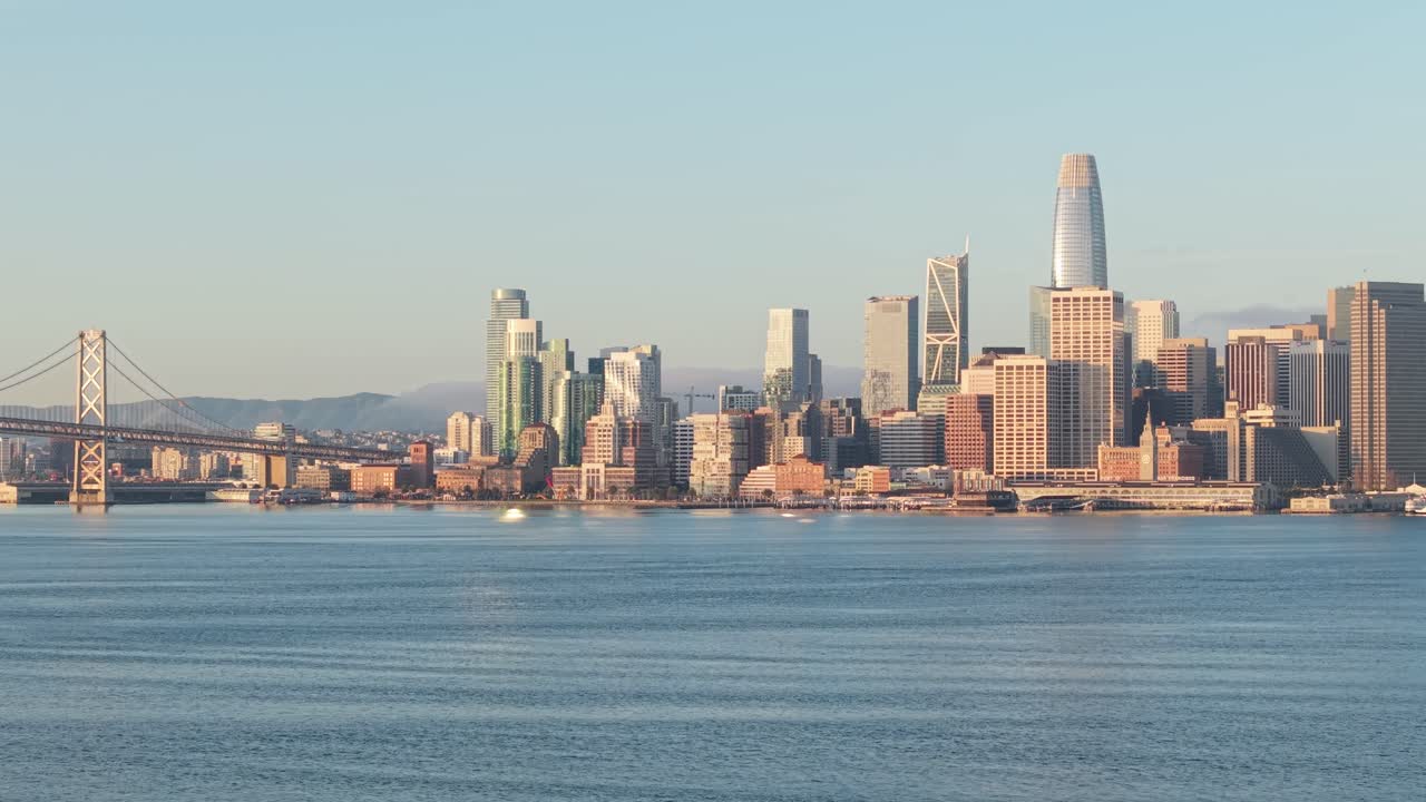 Dawn light fills the frame as the drone moves laterally across San Francisco’s towers, showing the city in a serene moment as the first hours of the day begin to unfold