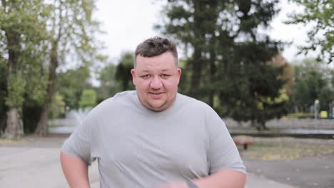 a very fat young man is running in the park a very fat young man is running in the park an overweight man loses weight runs