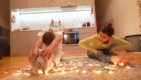 couple stretching at home