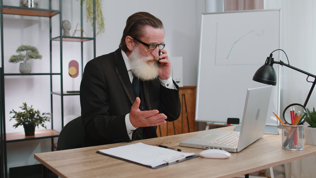 Angry businessmanin ceo making laptop call conversation at home office, quarrel conflict negotiation