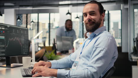 close up of happy trader in prop firm workplace analyzing market data