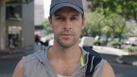 portrait-of-attractive-fit-young-man-wearing-sportswear-breathing-looking-pensive-on-city-street