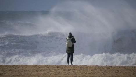 slow motion of a wave break on the beach in nazaré, portugal