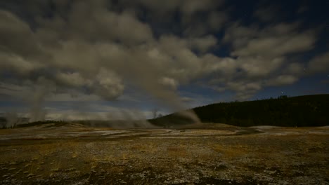 time lapse of old faithful in yellowstone national park on a windy day at dusk