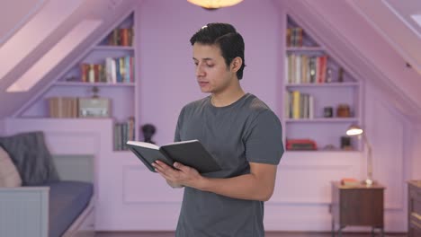 Happy-Indian-man-reading-a-book