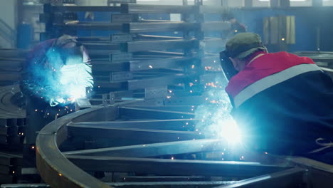 metal fabrication workers welding structural steel