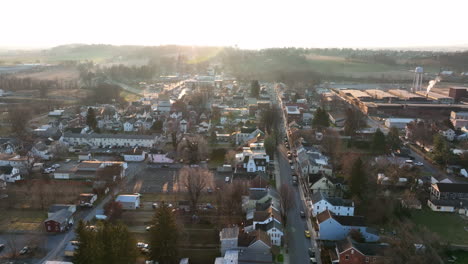 reverse dolly aerial shot of american town in winter