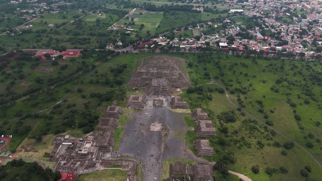 Aerial footage showing visitors on Pyramid of the Moon in Teotihuacan, Mexico