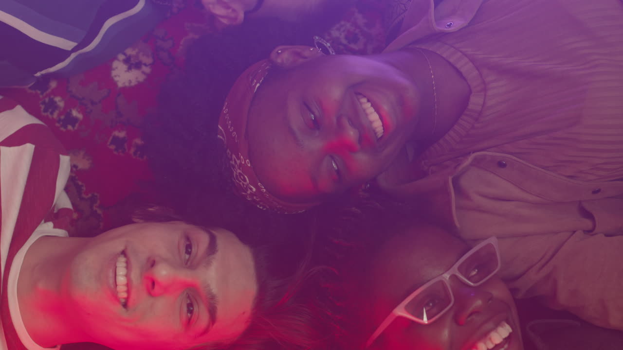 Multiethnic Group Of Friends Lying On Floor In Circle And Talking To Each Other 2