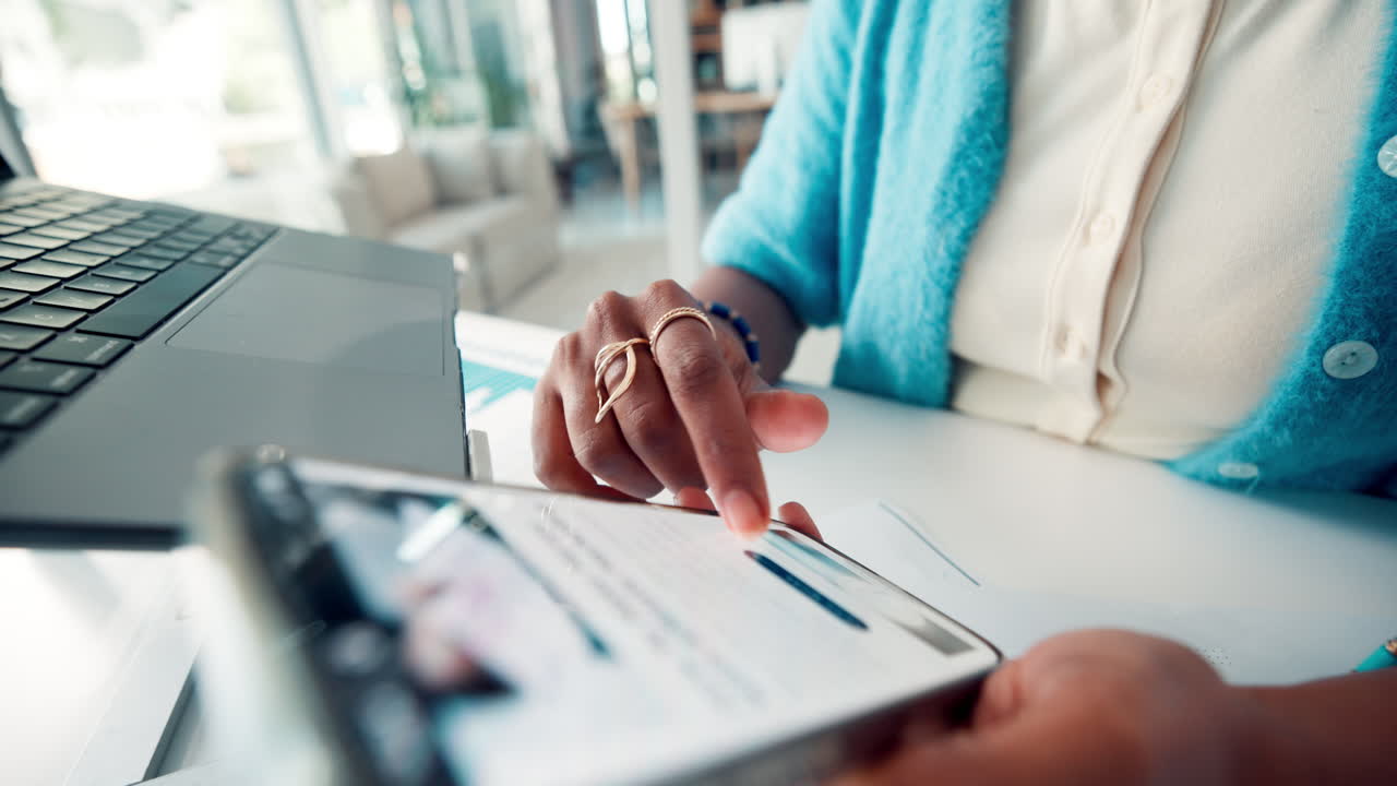 Close-up of a Person's Hands Scrolling on a Digital Tablet