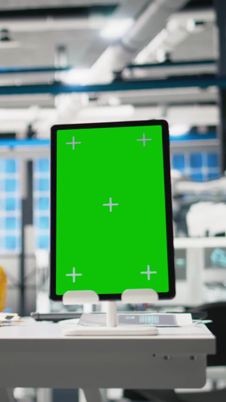 Vertical Video Empty engineering desk in a solar power manufacturing plant with green screen