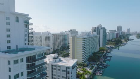 modern urban borough with multistorey luxury apartment buildings. forwards revealing sea coast. miami, usa