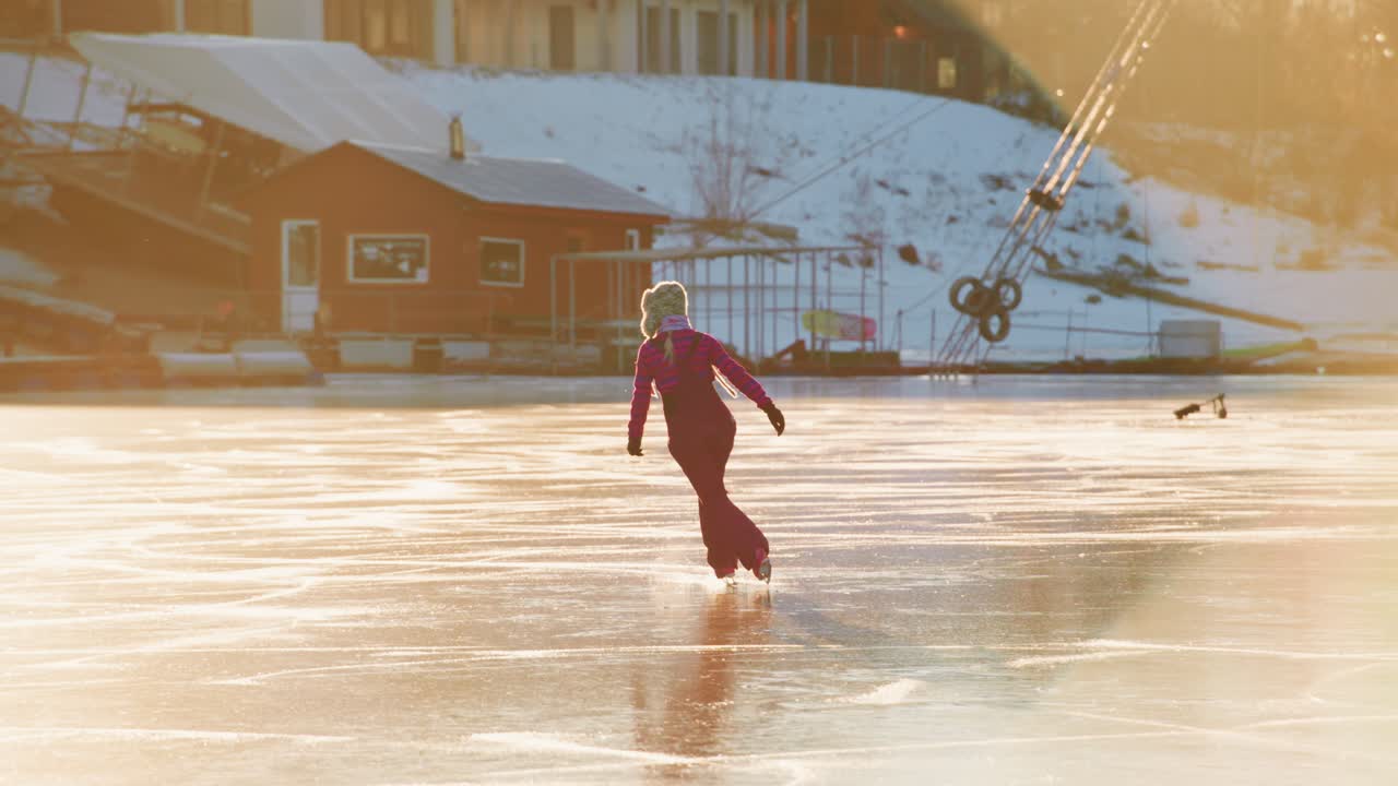 Woman ice skating on a frozen lake