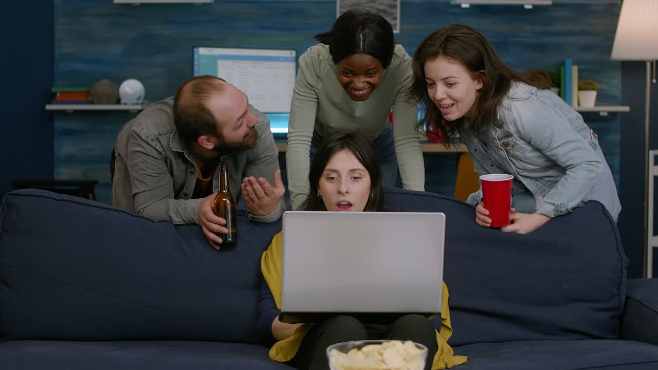 Group of mixed race people spending time together watching comedy movie