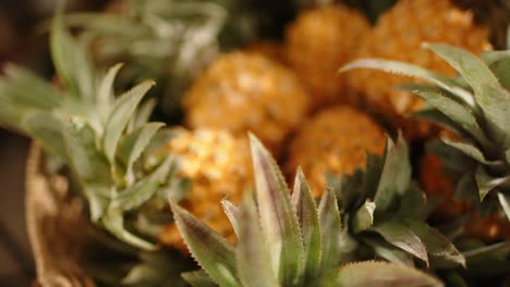 Close-up-of-pineapples-in-basket-at-health-food-shop