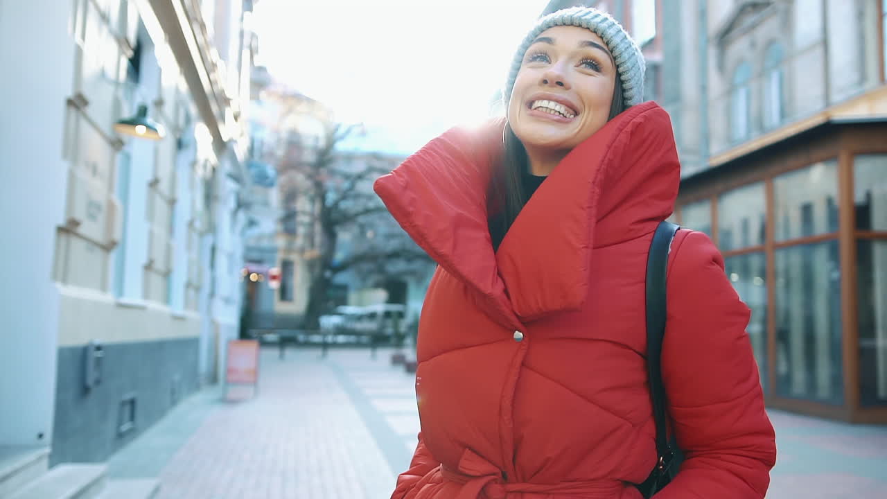 Woman in Red Jacket in City Street