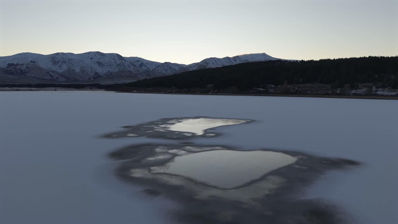 Beautiful frozen lake in winter at sunrise moment, Esquel, Chubut Province, Argentina