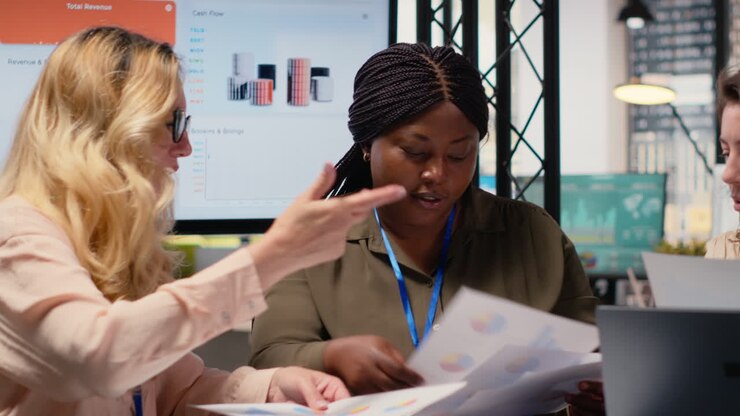 Team of career focused women aligning analytics and objectives