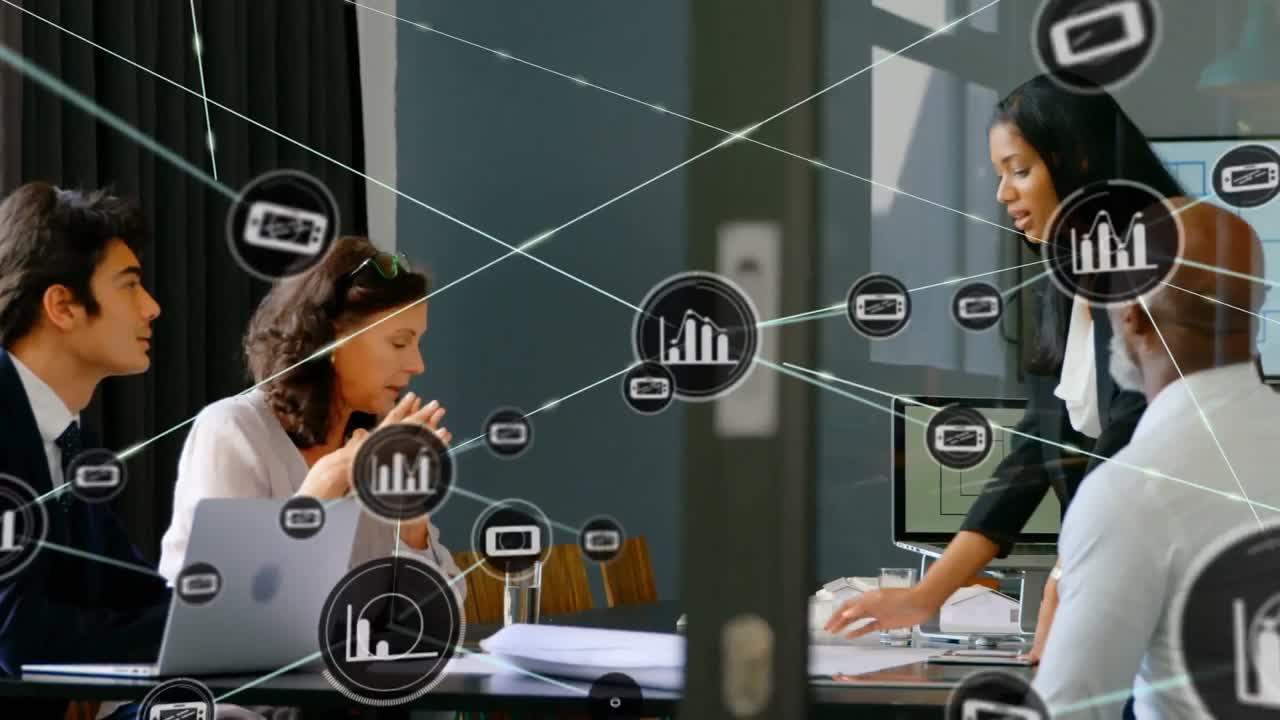 Animation of network of digital icons over diverse businesspeople discussing over a plan at office