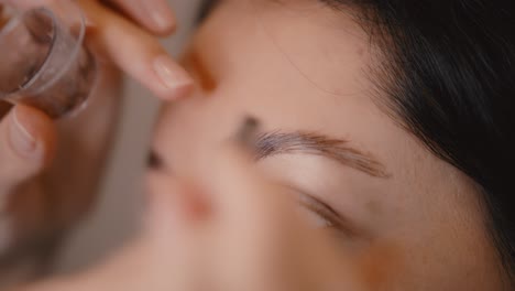 applying eyebrow makeup