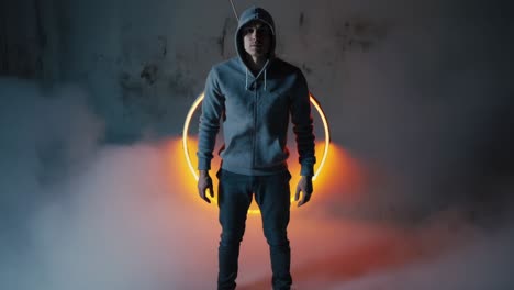 man in hoodie under ring light