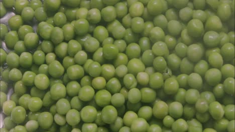 peas in a plate after cooking, ready to be mixed with pasta or rice and served