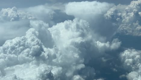 Awesome-view-of-a-stomry-sky-from-above,-while-flying-at-11500m-high