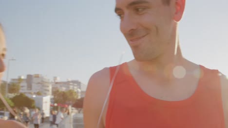 young adult couple walking at the seaside