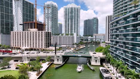 boats sail along the miami river in miami florida